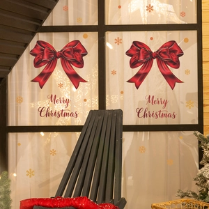 Stickers de Noël avec nœud rouge, flocons dorés et slogan Joyeux Noël pour fenêtre