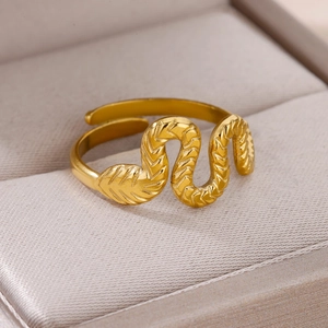 Macro shot of 18k gold plated stainless steel snake ring with textured wave design