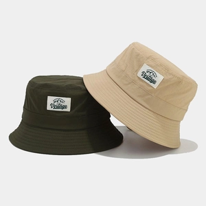 Quick-dry breathable bucket hats with letter patch and chin strap in green and beige