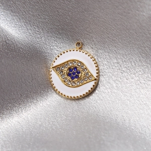 Goldener Edelstahl-Anhänger mit Bösem Blick, blauen Kristallen und Emaille-Finish