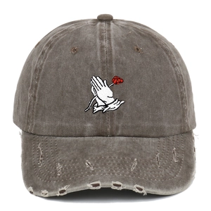 Vintage washed baseball cap with rose embroidery and distressed edges in brown-grey