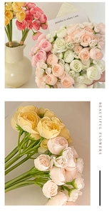 Close-up of artificial pink, white and yellow roses for wedding floral decoration