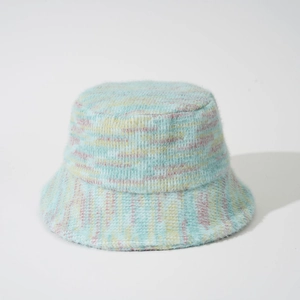 Close-up of fuzzy knit bucket hat showing colorful mohair texture and striped pattern