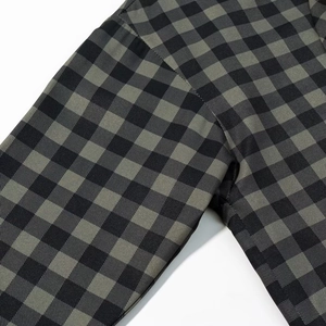 Close-up of black and grey gingham shirt showing detailed stitching and fabric texture