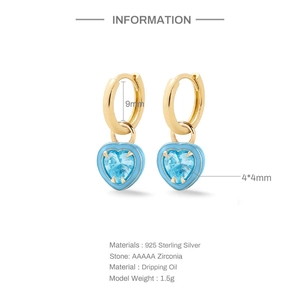 Detail view of gold S925 silver hoop earrings with light blue heart stones and 9mm hoop