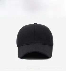 Front view of a thick knit baseball cap with a metal triangle plaque on a clean background