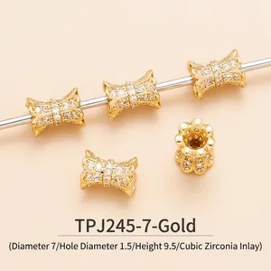 Macro detail of gold bow bead with cubic zirconia stones and exact sizing measurements