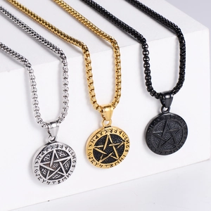 Detailed close-up of vintage pentagram rune pendants in silver, gold, and black finishes