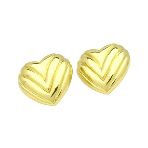 Detailed macro view of heart-shaped gold earrings with unique vertical textured grooves