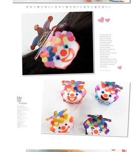 Detail of colorful clown pattern PVC hair claw clip showing various color options for women