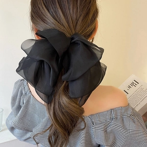 Elegant large black organza bow hair clip for women with a lightweight sheer 3D design