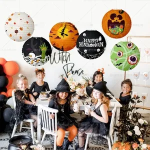 Set of 6 Halloween paper lanterns featuring ghosts and pumpkins for party decor