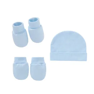 Detailed view of light blue 3-piece newborn set with cotton hat, mittens, and booties