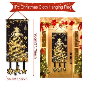 Close-up of black and gold Merry Christmas door banner with fabric texture details