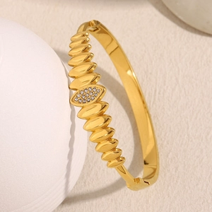 Close-up of 18K gold plated leaf bracelet featuring sparkling pavé rhinestone details