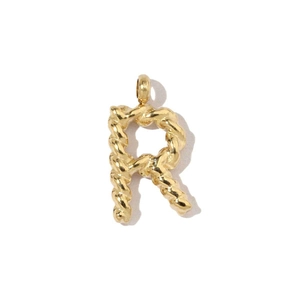 Close-up of 18k gold-plated letter R pendant with twisted rope metal texture on white background