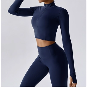 Detail of dark blue yoga set with zip-up cropped top, thumbholes and high waist leggings