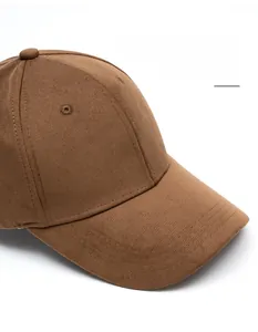 Detail view of brown cotton baseball cap showing reinforced stitching and eyelets