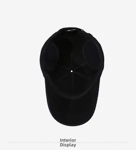 Detail view of the warm fleece lining and foldable ear flaps on the black winter baseball cap