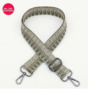 Close-up of woven ethnic bag strap with gunmetal swivel hooks and adjustable buckle