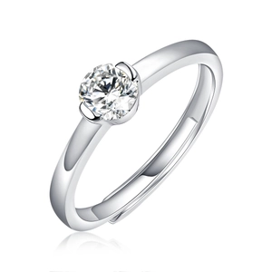 Macro shot of silver adjustable ring featuring a round brilliant cut moissanite stone