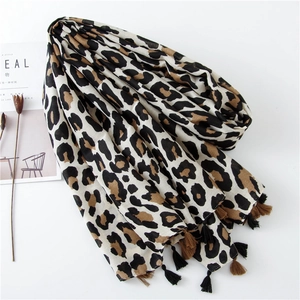 Classic leopard print scarf for women with fringe tassels on white background