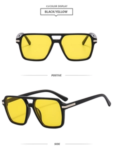 Detail view of vintage double bridge square sunglasses with black frame and yellow lenses