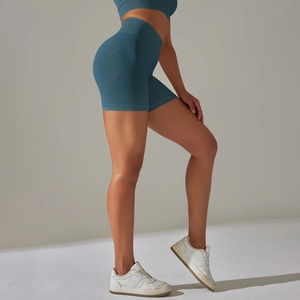 Detail of greyish-blue seamless yoga shorts with high waist and peach lift texture