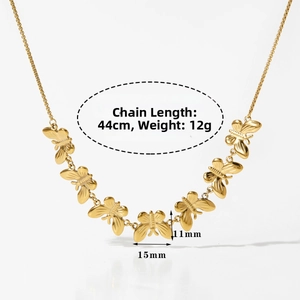 Detail view of gold butterfly necklace with 44cm chain length and 12g weight specifications