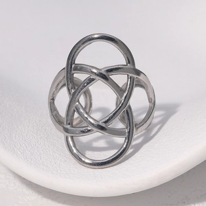 Macro shot of silver stainless steel ring with four interlocking circles design
