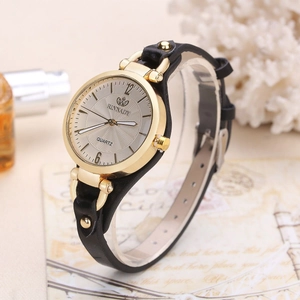 Women's quartz watch with gold round case and black leather strap on display