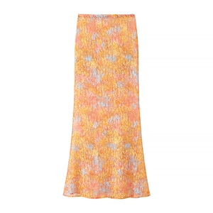 Close-up of orange floral lace texture and intricate patterns on the bodycon skirt