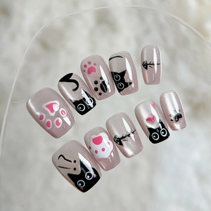 Handmade champagne cat eye press-on nails featuring cute black cat and paw designs