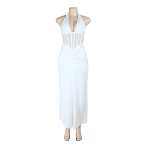 Detail view of the white halter neck dress featuring a sheer corset style waist design