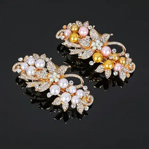 Barrettes à cheveux élégantes en forme de feuilles avec perles sur base dorée et miroir noir