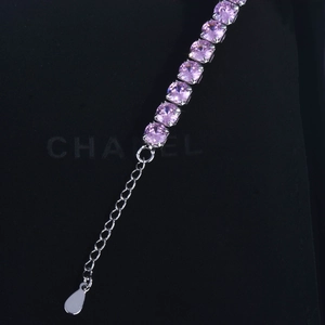 Elegant silver chain bracelet featuring round pink crystals and adjustable extender link