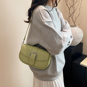 Chic avocado green saddle shoulder bag for women with silver buckle and slim strap