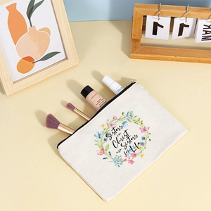 Detailed view of canvas pouch with floral print showing internal storage for cosmetics
