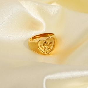 Detail of 18K gold stainless steel heart ring with pink zircon and angel relief