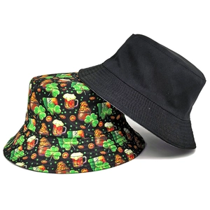 Reversible St. Patrick's Day bucket hat with green clover print and solid black side