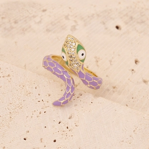 Gold snake ring with purple enamel scales and shimmering zircon pave setting