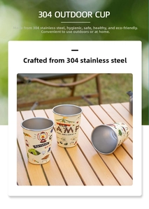 Close-up of 304 stainless steel camping cups with cream coating on a wooden table