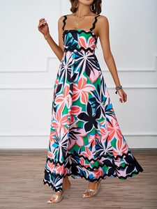 Detailed view of bohemian floral print maxi dress with black scalloped lace trim edges