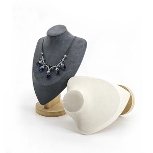 Detail of necklace bust display with solid wood base and soft velvet finish
