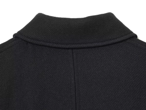Macro shot of black twill wool jacket back collar and neat stitching details