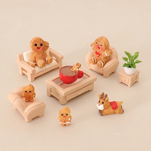Miniature Christmas gingerbread family scene with resin sofa and table figurines