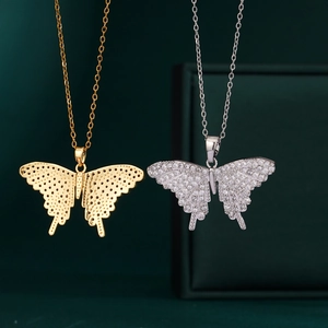 18K gold and silver butterfly necklaces with cubic zirconia and filigree details