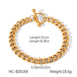 Macro shot of gold stainless steel Cuban chain bracelet with OT toggle clasp and dimensions