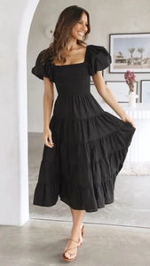 Detail of black off-shoulder midi dress with puff sleeves and smocked bodice design