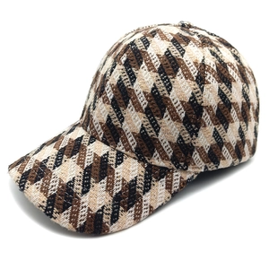 Classic houndstooth tweed baseball cap in brown and cream colors with curved brim